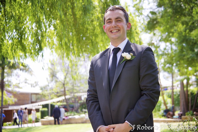 Groom laughing in gardens - wedding photography sydney